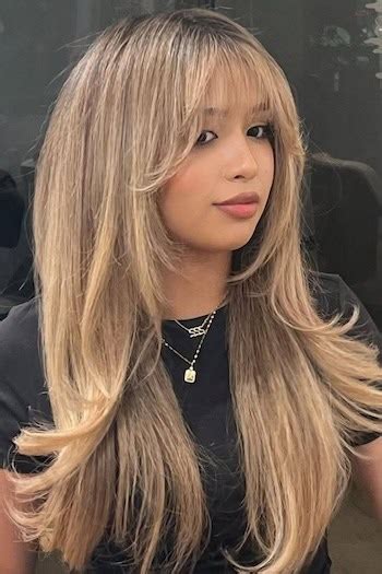 Long hair with tapered bangs and highlights